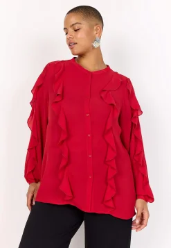 Blus med volanger