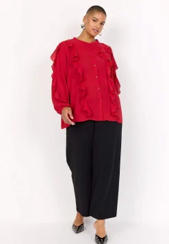 Blus med volanger